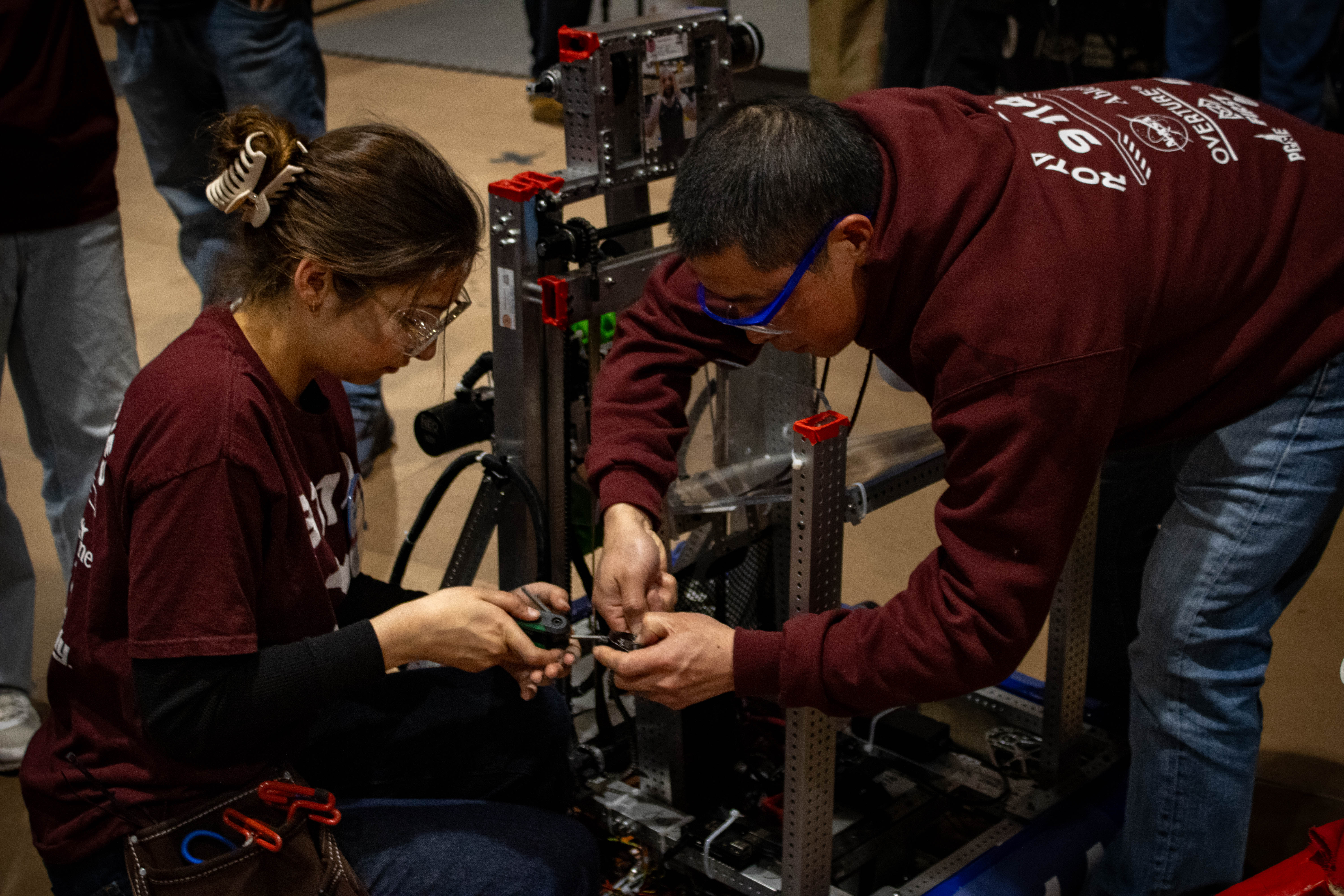 Rotationaries mechanical team building the robot